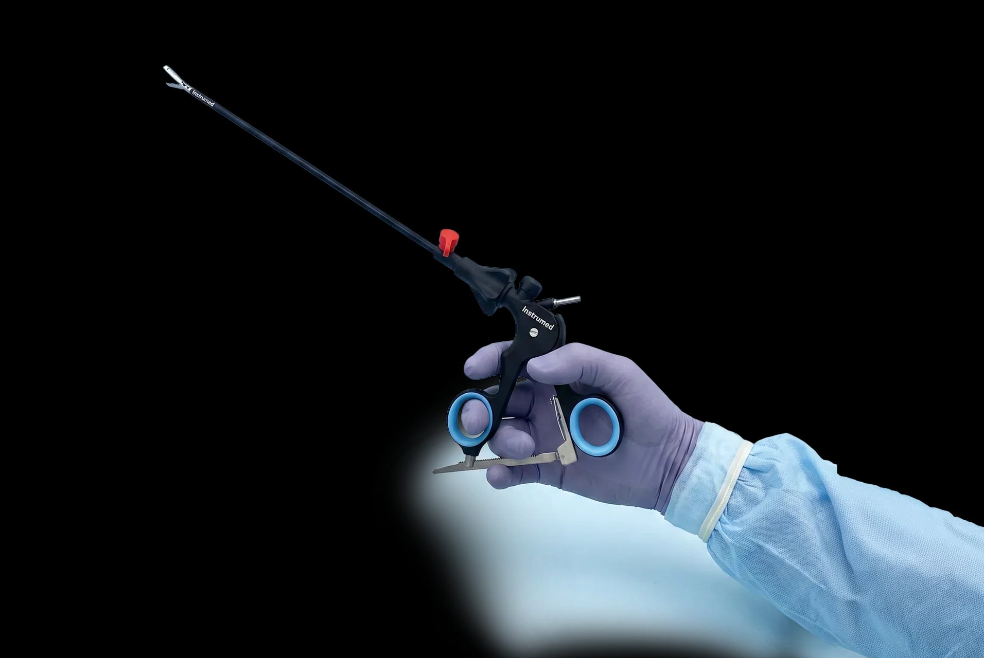 Laparoscopic instrument held by a gloved hand